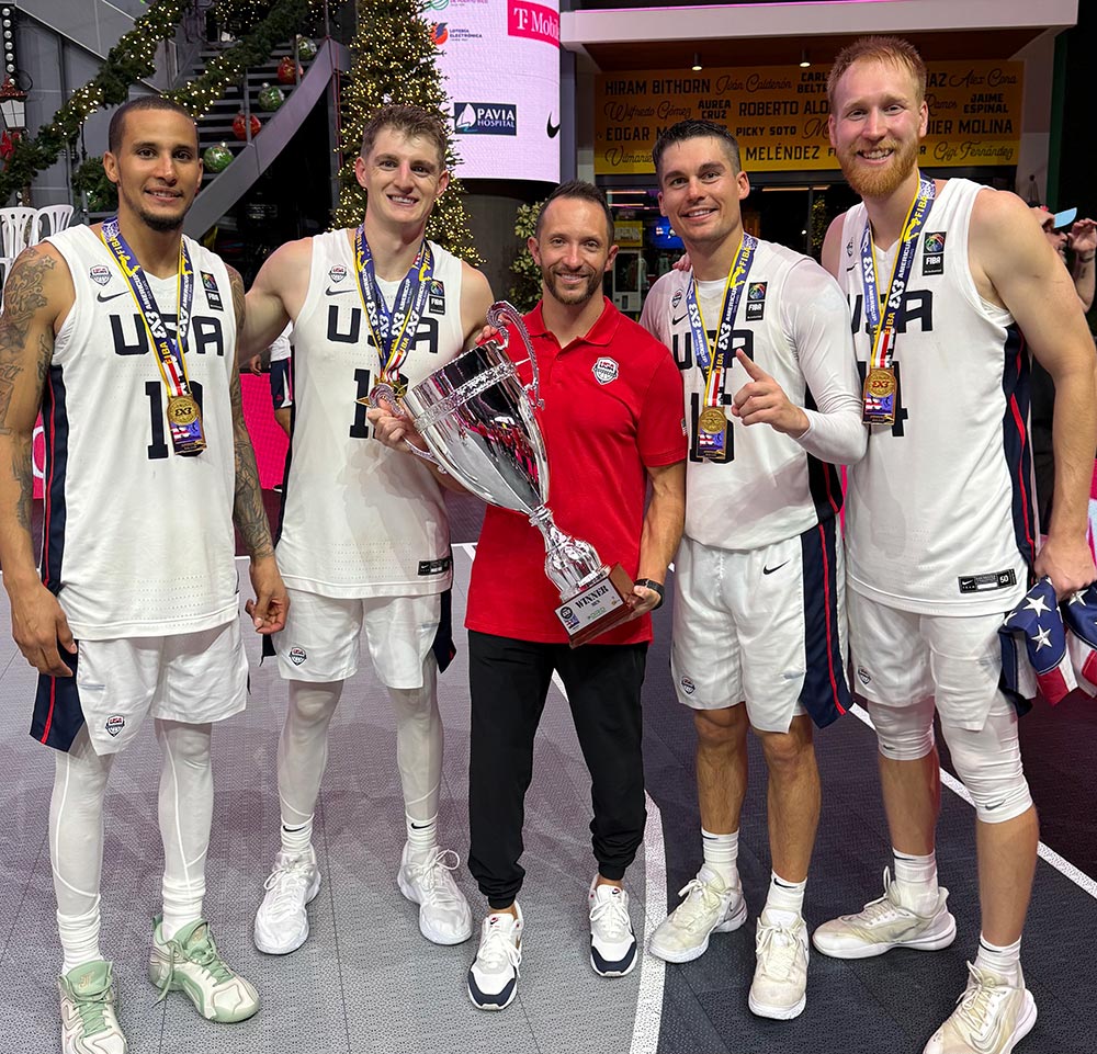 Brady Howe with USA men's basketball team members